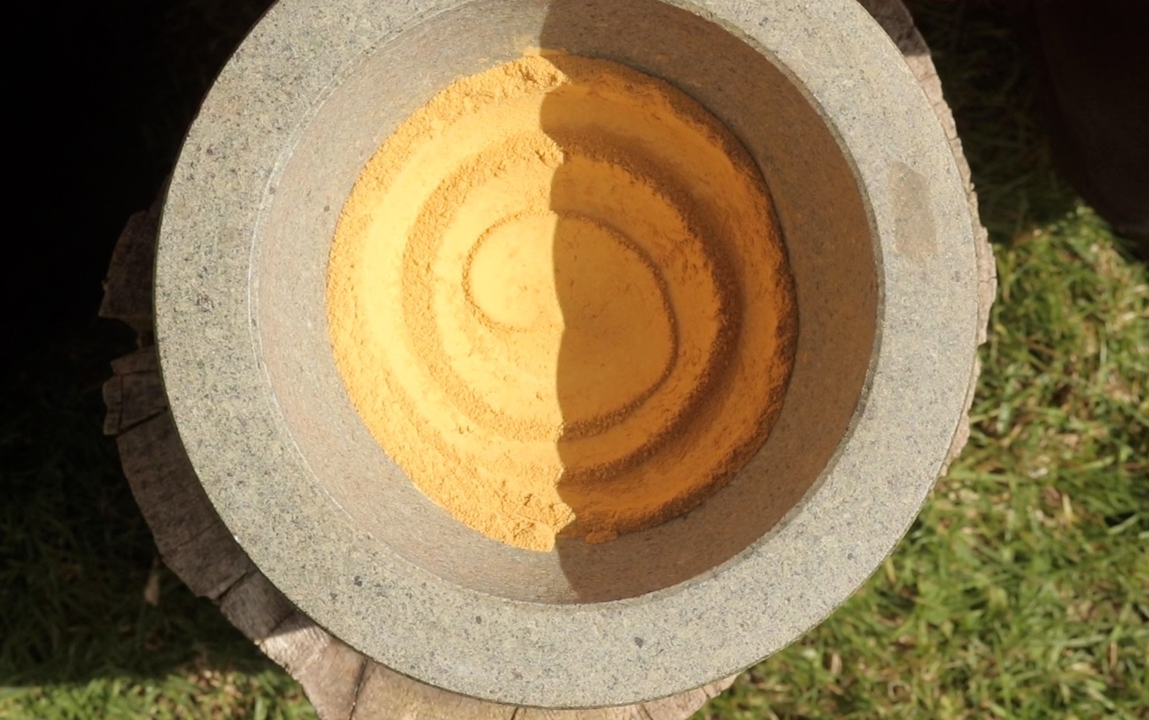 Grinding ochre into pigment